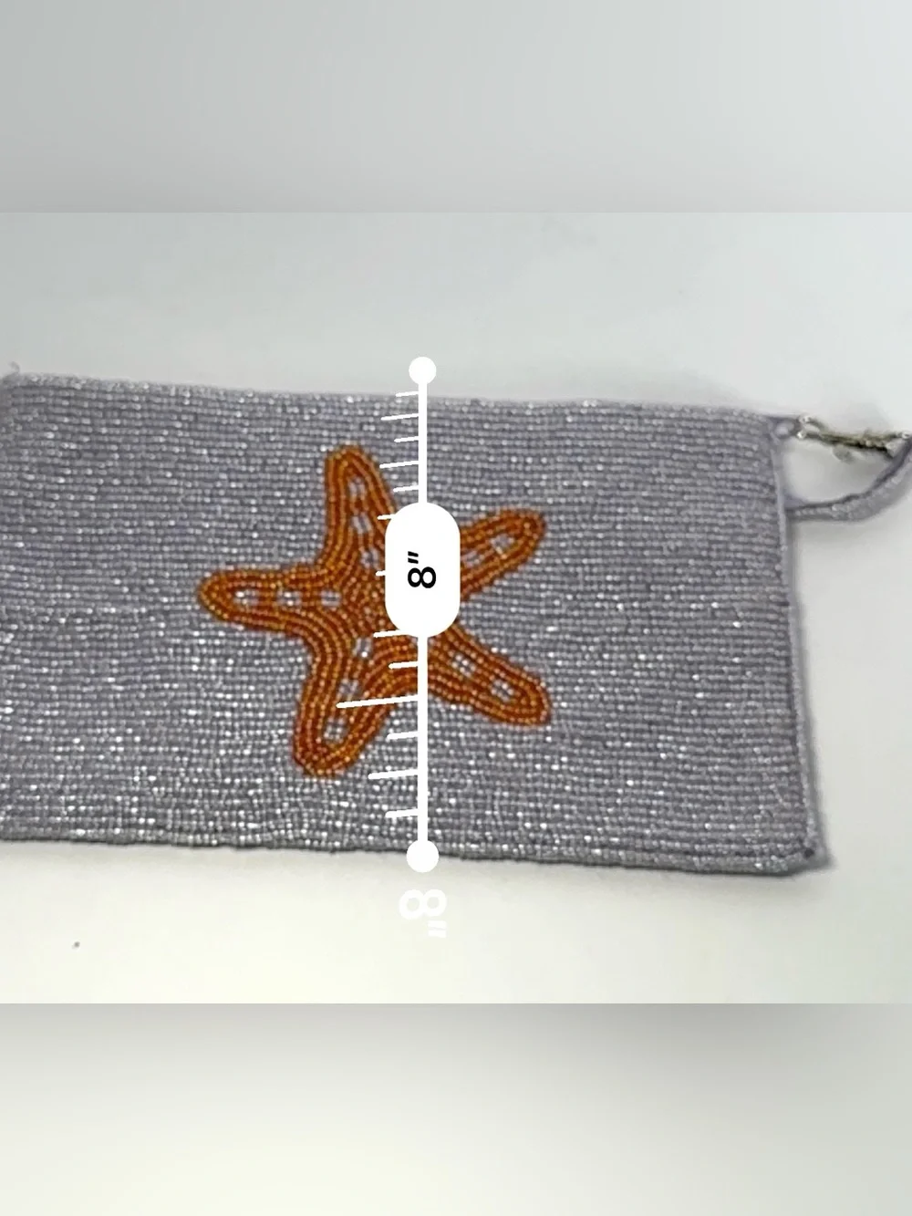 Viral K.C. Malhan hand-beaded starfish wristlet clutch